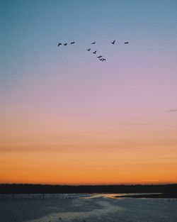Scenic view of sea against clear sky during sunset