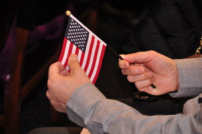 Midsection of man with american flag