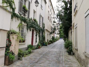 Alley amidst buildings in city