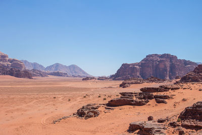 Scenic view of desert against clear sky