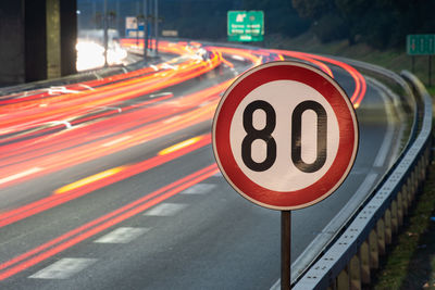 Illuminated light trails on road at night