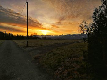 Scenic view of field against sky during sunset