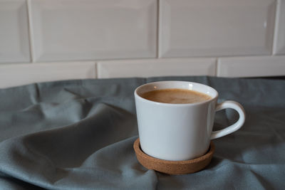 Close-up of coffee cup on table