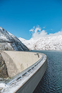 View of dam with mountain in background