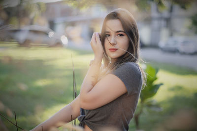 Portrait of young woman standing outdoors