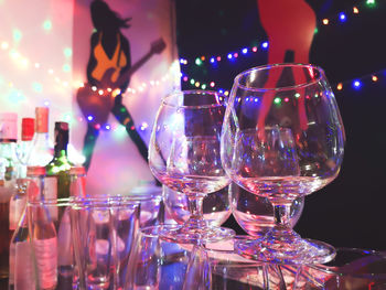 Close-up of wine glasses on table