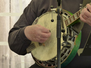 Cropped image of woman holding guitar