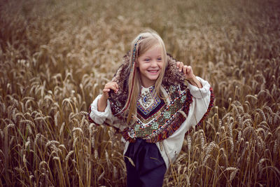 Girl indian shaman blonde in a poncho and a dream catcher