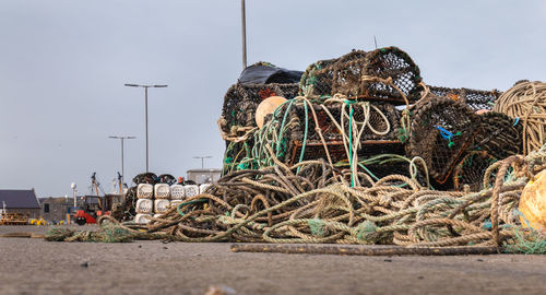 Fishing net on shore against clear sky