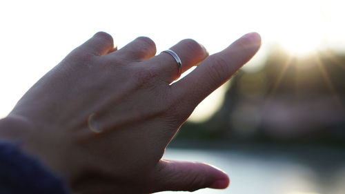 Close-up of hand against blurred background