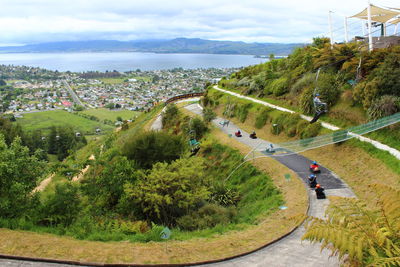 High angle view of people on race track against sky