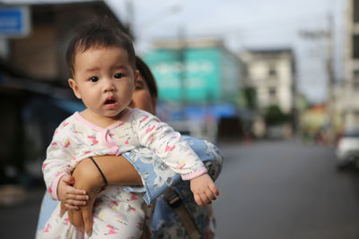 Portrait of cute girl standing outdoors