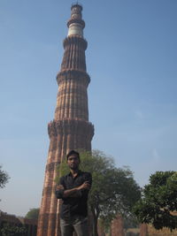 Low angle view of a man against clear sky