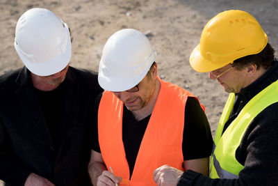 Coworkers working at construction site