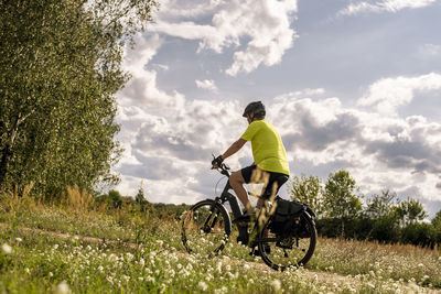 Mature man on a tour with an e-bike