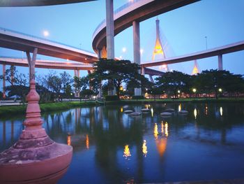 Reflection of illuminated bridge in water