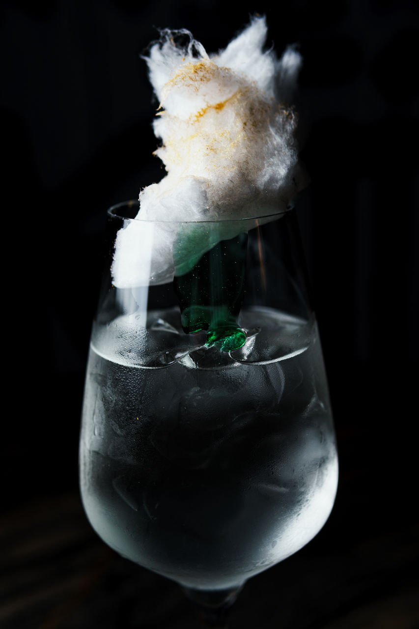 black background, macro photography, indoors, close-up, food and drink, white, smoke, studio shot, no people, darkness, frozen, nature, drink, food, cold temperature, flower, freshness, glass, alcoholic beverage, refreshment, drinking glass