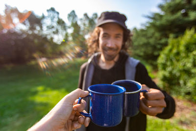 Portrait of smiling man holding coffee cup