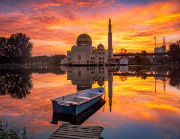 Scenic view of lake against sky during sunset