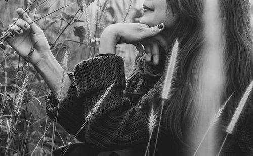 Young woman with trees in background