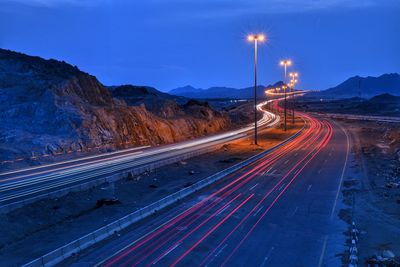 Light trails on highway at dusk