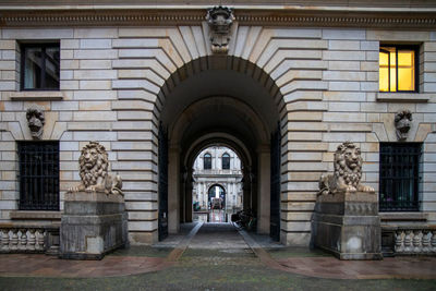 Statue in front of historic building