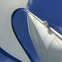 Low angle view of sailboat mast against sky