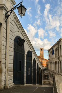 The rialto bridge with the bell tower of san giovanni elemosinario church in the background, venice