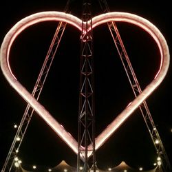 Low angle view of illuminated lights at night