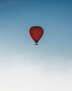 Low angle view of hot air balloon against blue sky