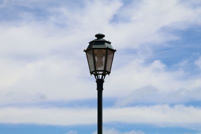 Low angle view of lamp post against sky