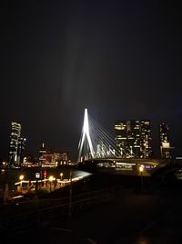 Illuminated suspension bridge at night