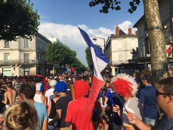 Group of people in front of buildings