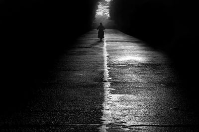 Woman walking on road