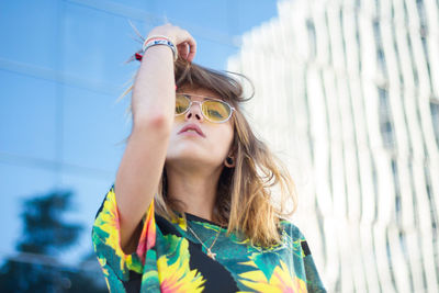 Portrait of young woman wearing sunglasses