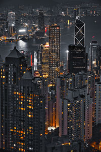 High angle view of illuminated buildings in city at night