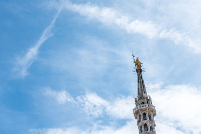 Low angle view of clock tower against sky