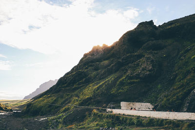 Scenic view of landscape against cloudy sky