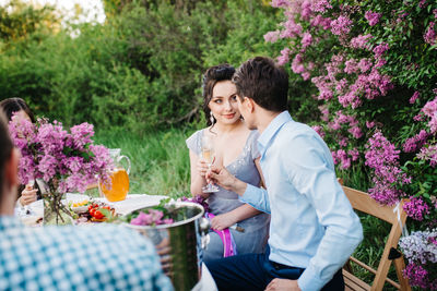 Young couple kissing on flower