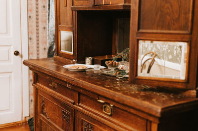 Vintage retro wooden granny sideboard or buffet with mirrors, decorated with christmas fir tree