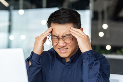 Portrait of young man using mobile phone