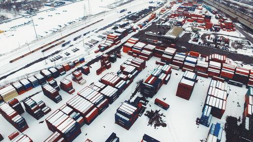 High angle view of shipping containers on snow covered field