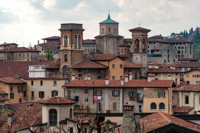 Buildings in city against sky