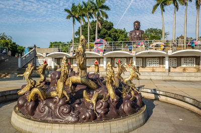 Statue in front of building