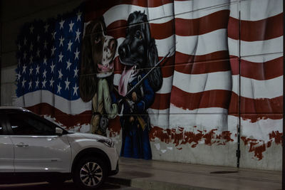 Graffiti on wall of car