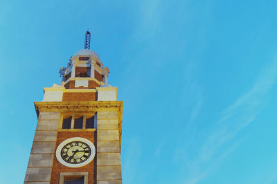 Low angle view of clock tower against sky