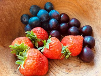 Strawberries, plums , cherries in bowl. fresh, colourful, juicy, sweet, nutritious, summer fruit.