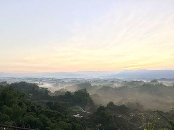 Scenic view of landscape against sky during sunset