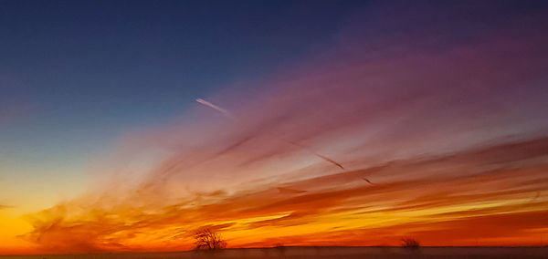 Low angle view of cloudy sky during sunset