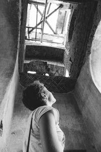 Rear view of man climbing steps